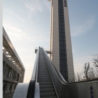 Outside Escalator with High Rise